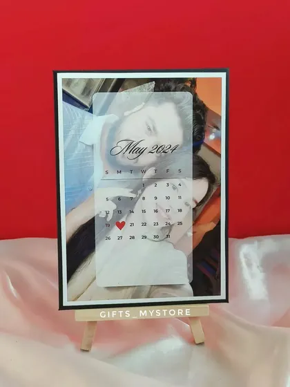 A personalized calendar frame highlighting the couple's special date, a key element of my engagement anniversary hamper.