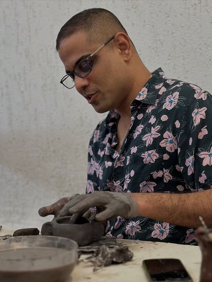 A rainy Sunday well spent. This participant is focused on shaping his bowl, surrounded by the quiet, creative energy of the group.
