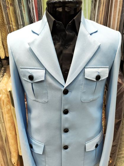A clear studio shot of the sky blue safari jacket, a great option for a smart-casual look.