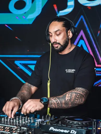 In the zone, mixing tracks at a packed event in Goa. I focus on reading the room and blending Bollywood, Punjabi, and global hits seamlessly to keep the energy flowing.
