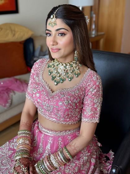 This image shows the complete look with jewellery and bangles. You'll learn to consider all elements of the bridal attire when designing the makeup.