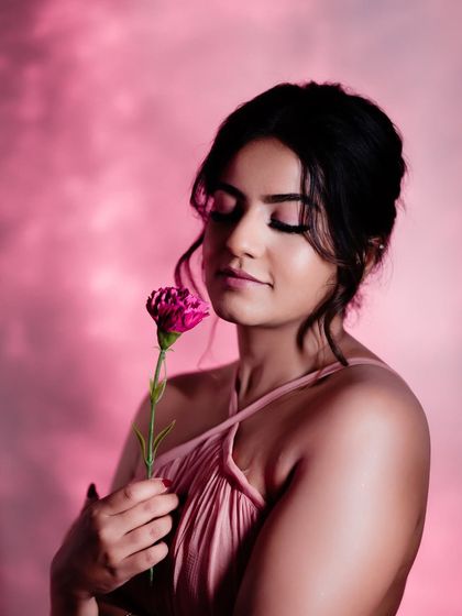 A close-up on the soft pink makeup, which perfectly complements the dress and the mood.