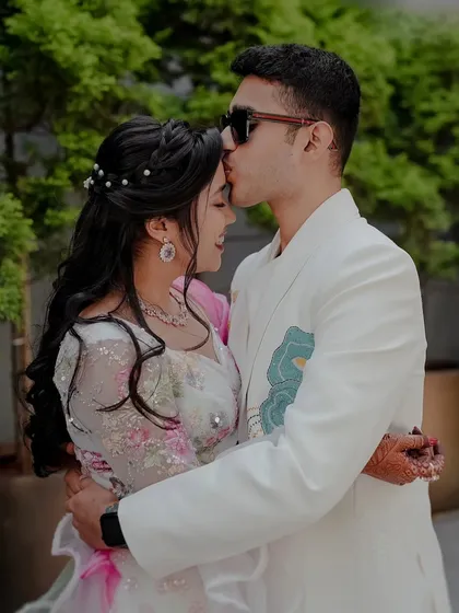 A sweet moment between the couple during the Carnival. Her makeup stayed flawless and fresh throughout the day's events.