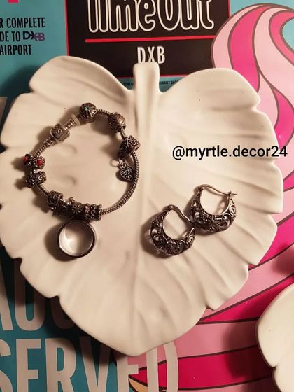 Our white leaf tray is a beautiful way to store your bracelets and earrings.