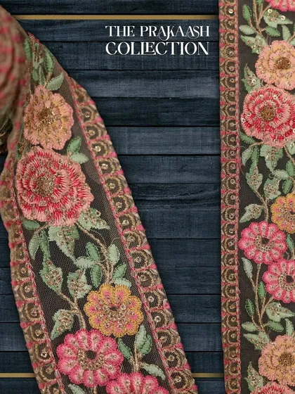 A close-up of a wide, floral designer lace featuring multi-colored threadwork embroidery. This type of intricate border is perfect for adding a luxurious finish to bridal lehengas, dupattas, and ethnic gowns.