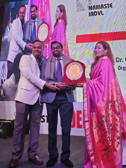 Dr. Kavish Chouhan receiving the Presidential Appreciation award from IADVL DSB for his role as the Trichology Workshop Chairperson at DERMAZONE. This recognizes his contribution to the field of dermatology.