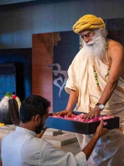 A sacred moment during the graduation ceremony, where Sadhguru offers his blessings. This consecrates our journey as teachers, empowering us to share this science with the world.