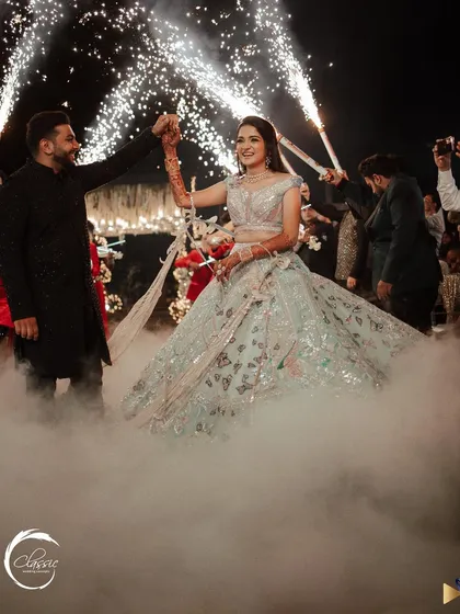 Making the couple's entrance unforgettable. I used a combination of low-lying fog and cold-pyro sparklers to create this dramatic and dreamy effect as they made their way to the dance floor.