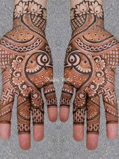 A classic design featuring large paisley or 'ambi' motifs, filled with intricate details.