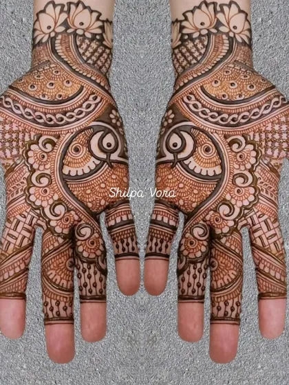 A classic design featuring large paisley or 'ambi' motifs, filled with intricate details.