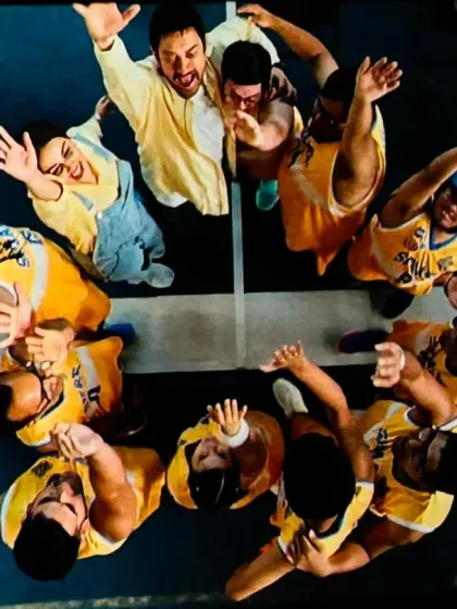 This powerful overhead shot from the film captures the unity and spirit of a team huddle. This is the energy we strive to create in our own teams every day.