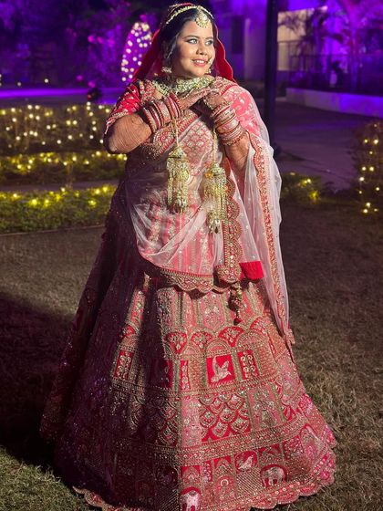 The bride's happy twirl showcases the movement of her lehenga and the durability of her makeup and hair.