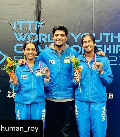 Posing with the silver medals at the ITTF World Youth Championships.