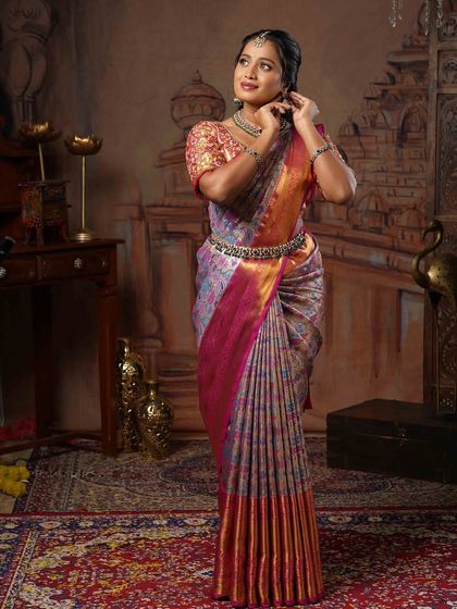 A candid moment showing how comfortable and confident you can feel in a well-draped saree. The pleats stay in place, allowing for easy movement while maintaining a graceful look.