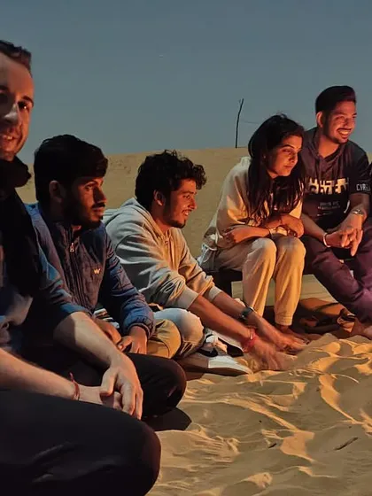 Laughter and conversations around a bonfire in the desert. It's a simple pleasure that brings everyone together.