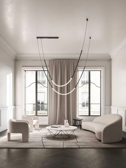 A Leda suspension light elegantly draped in a classic Parisian-style apartment. This shows how a modern lighting system can complement and enhance traditional architecture.
