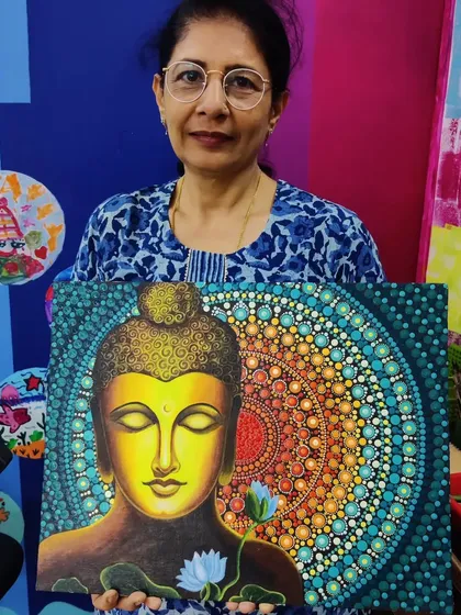 A participant proudly displays her stunningly detailed Buddha painting, a combination of acrylics and dot mandala art on canvas. This piece highlights the serene and meditative outcomes possible in my adult workshops, perfect for anyone looking to reconnect with their creativity.