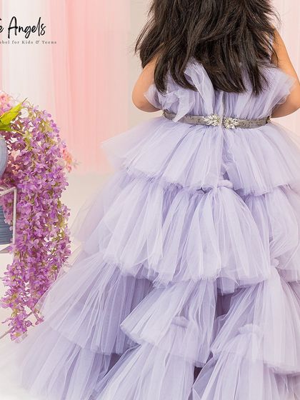 The back view of the lilac gown highlights the beautiful layers of tulle and the crystal embellished belt.