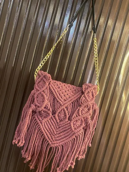 Here is the same fringed boho bag styled with the elegant gold chain and leather strap. This small change makes it suitable for an evening out.