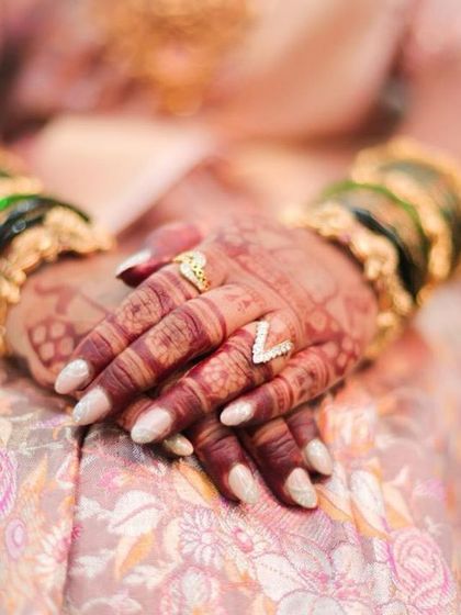 The final result. This is the beautiful, dark henna stain after 48 hours, adorned with rings and bangles. This is the goal for every design I create.