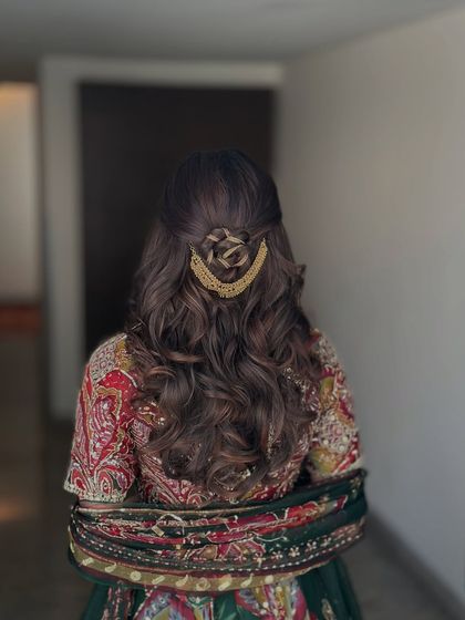 A clear back view of the complete hairstyle, perfect for a mehndi or sangeet.