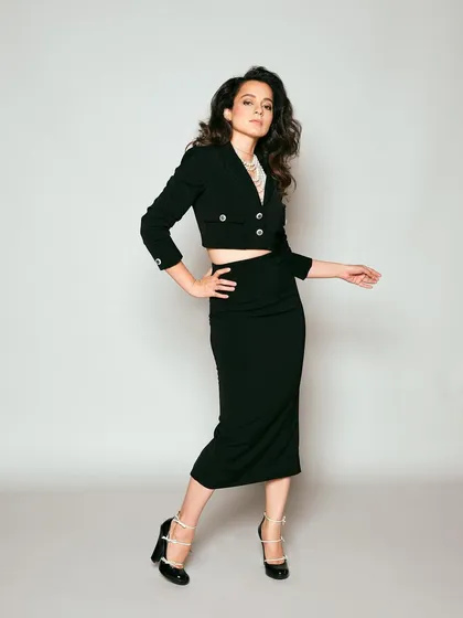 For Kangana Ranaut's trailer launch, we went for a chic and powerful look. This black cropped blazer and pencil skirt co-ord set from Ritu Neeva, layered with classic pearl necklaces, is all about sophisticated power dressing for press events.