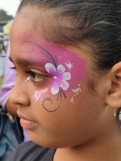 A beautiful floral design in shades of pink and white, with swirls and glitter accents.