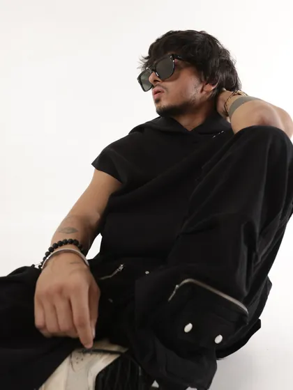 Another shot from the 2024 session, this time in a sleeveless hoodie. It showcases a more casual, street-style side of my brand.
