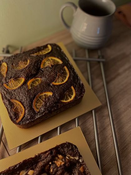 A close-up of the orange chocolate whole wheat cake, cooling on a rack. The aroma of chocolate and citrus filling the kitchen is just heavenly.