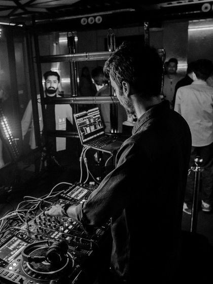 An identical shot to the last, but here the focus is on the craft of DJing and the gear.