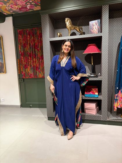 Dressed in a stunning blue kaftan at the new Rishi & Vibhuti store. I partner with Indian designers to launch their spaces with an event that captures the royalty and artistry of their collections.