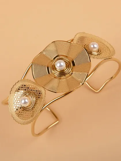 Another angle of the gold floral cuff, showing its three-dimensional quality.