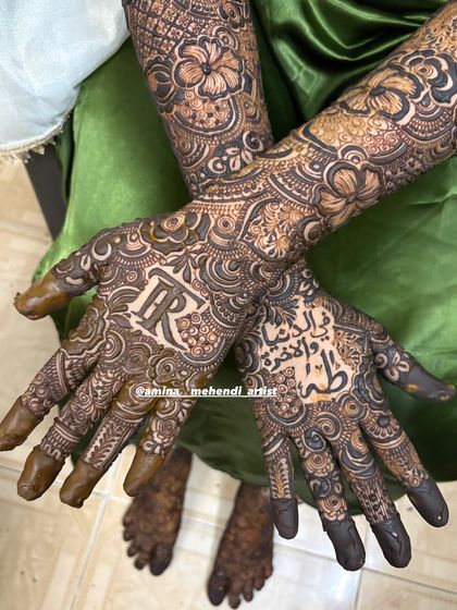 This full design incorporates both the initial 'R' and a special Arabic phrase, surrounded by dense, beautiful patterns.