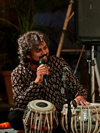 During a performance, I often speak to the audience, sharing context about the music. Here I am at a Courtyard Baithak, explaining a piece during a thumri and dadra concert.