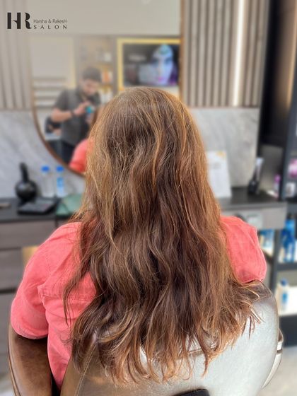 The before shot, showing hair that is ready for a color refresh and some added dimension.