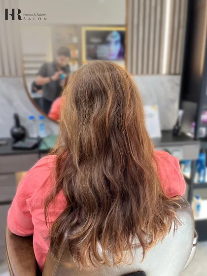 The before shot, showing hair that is ready for a color refresh and some added dimension.