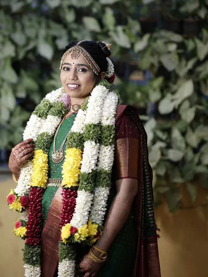 A portrait of Varsha on her wedding day. Her makeup is kept classic and radiant to honor the traditions of the Iyengar ceremony.