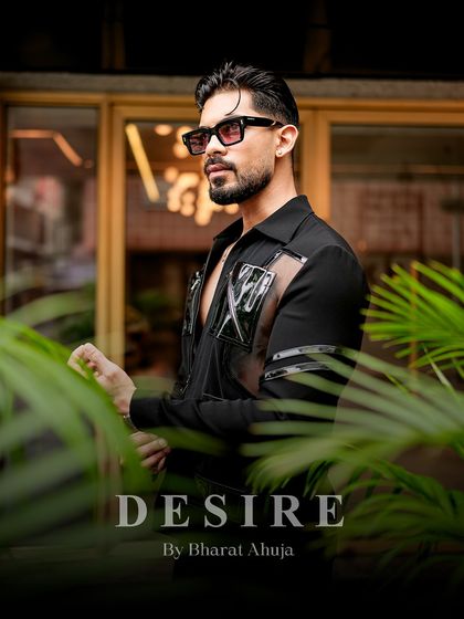 Another angle of the black utility shirt, showing how it combines sharp tailoring with a rebellious, modern aesthetic.