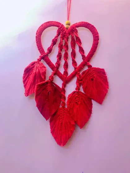 The finished red heart wall hanging. It's a passionate and romantic piece, perfect for adding a bold statement of love to your decor.