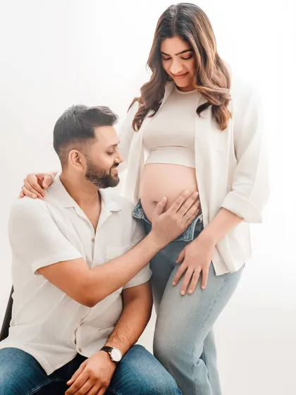 The look of adoration from a partner says it all. This bright, high-key studio setup is perfect for creating clean and joyful couple portraits in casual attire.