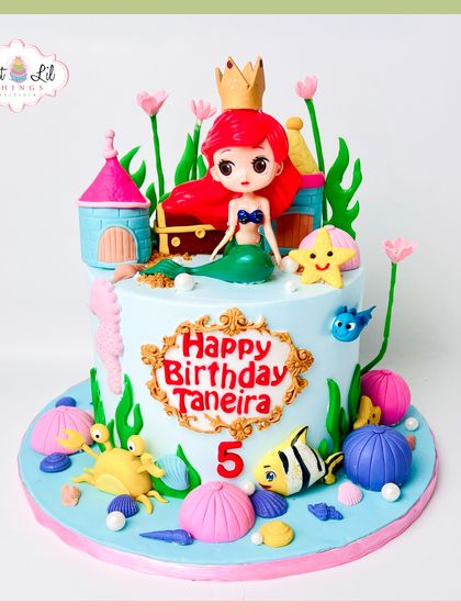 Under the sea is the place to be! This Little Mermaid cake for a 5th birthday is a vibrant underwater scene, complete with Ariel, a castle, and friendly sea creatures like Flounder and Sebastian.