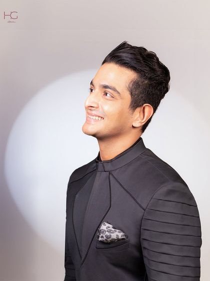 For the Ambani wedding festivities, I designed this achkan for Ranveer Allahbadia to channel his inner superhero. The structured shoulders and pleated sleeves create a powerful silhouette.