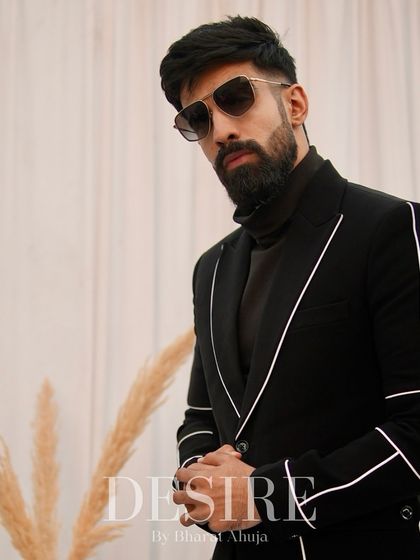 Perfectly tailored to exude confidence and elegance, this black blazer with white piping is a go-to for any occasion that calls for sharp dressing.
