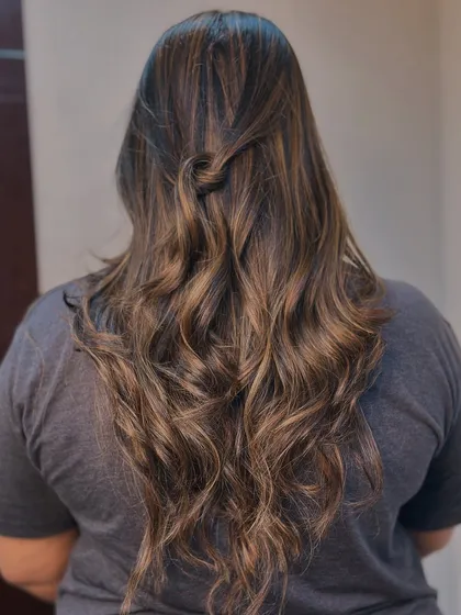 This half up style is a simple yet elegant way to show off the beautiful warm tones in her freshly colored hair.