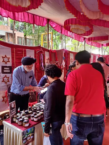 My husband Ekbal Singh helping customers at our stall. We believe in giving the best experience, from tasting samples to arranging delivery.