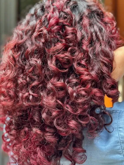 The back view shows the full intensity of this stunning red balayage.