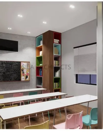 A view of one of the smaller learning nooks, complete with a chalkboard, colorful bookshelves, and comfortable seating, designed to make learning fun.