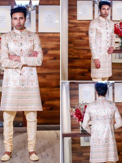 This off-white sherwani with subtle pastel floral prints is perfect for a day wedding or a summer celebration. It's light, elegant, and stylish.