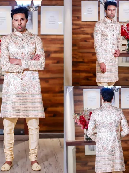This off-white printed sherwani offers a subtle yet sophisticated pattern. It's a versatile piece that works for both day and night events.