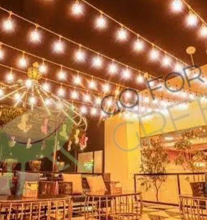 A wide shot of the stunning rooftop setup at Lord of the Drinks, Agra, furnished by us. We work with commercial clients to provide bulk quantities of high-quality, design-forward outdoor furniture.